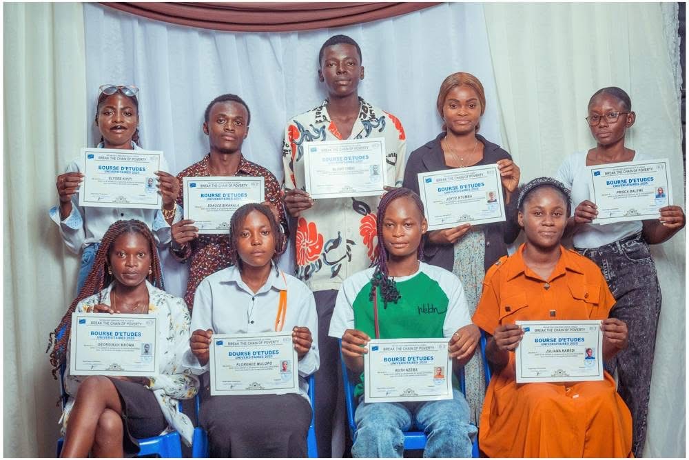 AAE scholarship recipients holding their university scholarship certificates